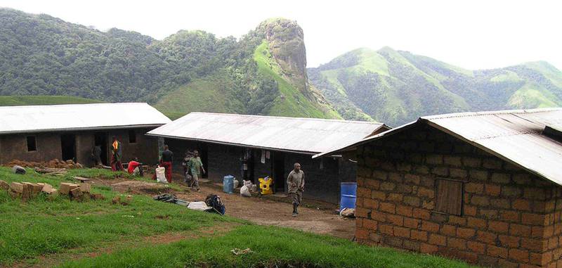 The WCS research camp and eco-guard post perched on the forest edge at 1,800 m above sea level. Cross River gorilla monitoring and protection activities are coordinated from this camp. (© WCS, Aaron Nicholas)